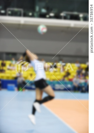 Blurred female volleyball player 38786954