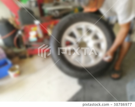 repairing flat car tire with repair kit repairing flat car tire with repair kit 38786977