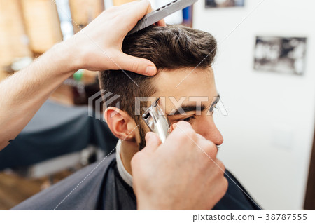 Barber shave and modeling beard at the hair salon Barber shave and modeling beard at the hair salon 38787555