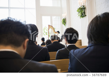 Attendees watching over the wedding ceremony 38787689