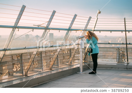 Minsk, Belarus. Young Woman Looking At Coin 38789250