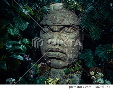 Olmec sculpture carved from stone. Big stone head Olmec sculpture carved from stone. Big stone head 38791035