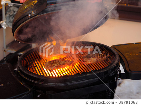 Delicious fried beef steak on an open fire Delicious fried beef steak on an open fire 38791068