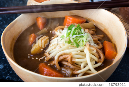 Japanese curry with udon noodle. 38792911
