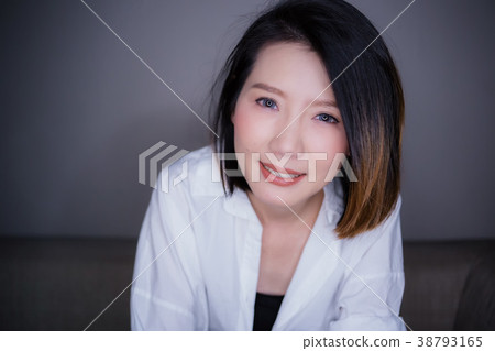 beautiful asian woman white shirt with thinking 38793165