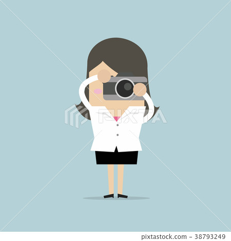 Businesswoman takes a picture with camera. 38793249
