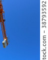 Construction site crane which shines in blue sky 38793592