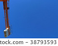 Construction site crane which shines in blue sky 38793593
