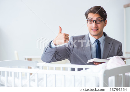 Young businessman trying to work from home caring Young businessman trying to work from home caring 38794264
