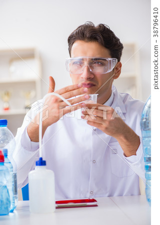 Lab assistant testing water quality Lab assistant testing water quality 38796410