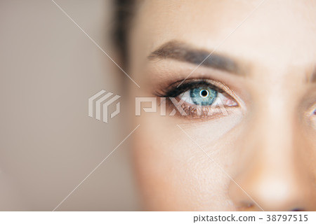 Close-up shot of beautiful blue eye of the 38797515