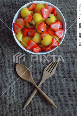 strawberry and watermelon with wood spoon. 38797899