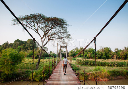 tourist wooden suspension bridge cross over river 38798298