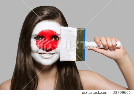 Female supporter in national colors of Japan Female supporter in national colors of Japan 38799605