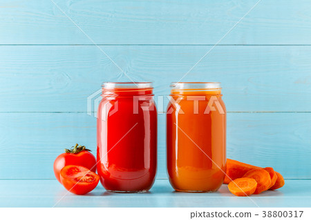 Orange/red colored smoothies / juice in a jar Orange/red colored smoothies / juice in a jar 38800317