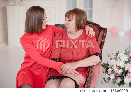 Mature Mother And Daughter Hugging. Mature Mother And Daughter Hugging. 38800659