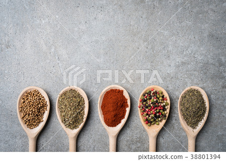 Fresh herbs and spices on wooden spoons. Fresh herbs and spices on wooden spoons. 38801394