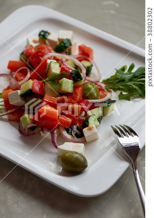 Greek salad .Fresh, with olive oil and red onion Greek salad .Fresh, with olive oil and red onion 38802302