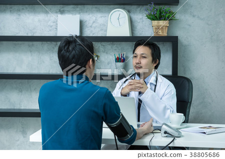 Asian male doctor discussing diagnosis with patient about his health which using technology laptop in modern office of hospital, physician concept Asian male doctor discussing diagnosis with patient about his health which using technology laptop in modern office of hospital, physician concept 38805686