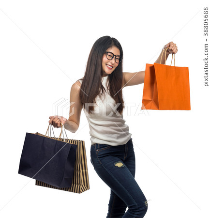 Happy young asian woman shopping in happy feeling and holding the product paper bag in white background, include clipping path Happy young asian woman shopping in happy feeling and holding the product paper bag in white background, include clipping path 38805688
