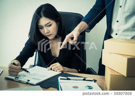 Chinese woman is working with angry boss blaming 38807808