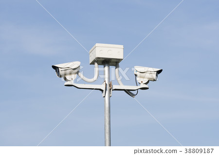 cctv security camera on blue background, property  38809187