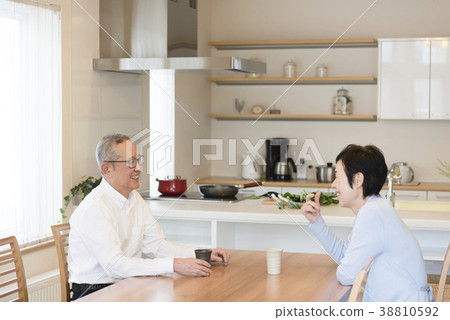 Elderly couple having a face-to-face conversation Elderly couple having a face-to-face conversation 38810592