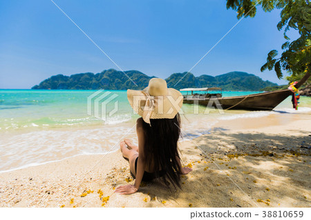 Asian women Sitting on the beach at Koh Phi Phi 38810659