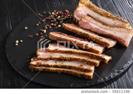 sliced spicy smoked speck, top view sliced spicy smoked speck, top view 38811196