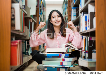 Asian female student was delighted to find answer 38811625