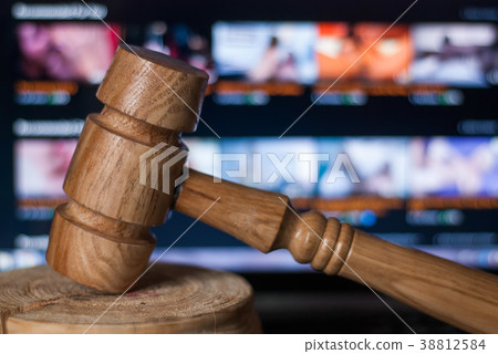 The gavel against the background of the laptop, 38812584