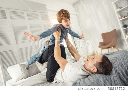 Inspired son and daddy playing together 38812712