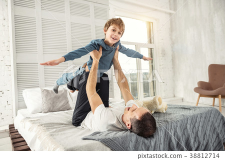 Joyful son and daddy playing together 38812714