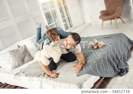 Laughing son and daddy playing together 38812716