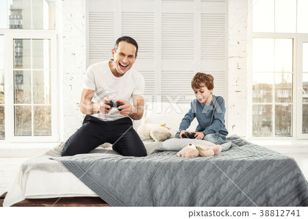 Happy dad and son playing games 38812741
