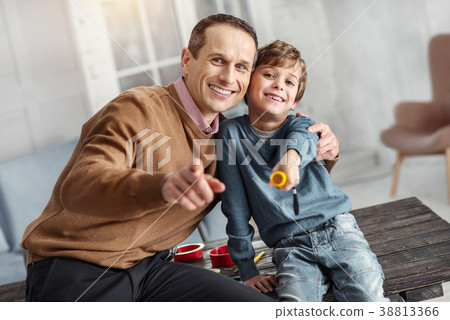 Happy daddy and son hugging and smiling 38813366
