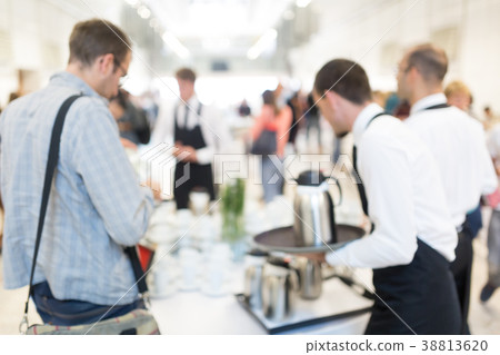 Blured image of businesspeople at coffee break at 38813620