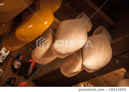 Clogs made of poplar wood hang 38813848