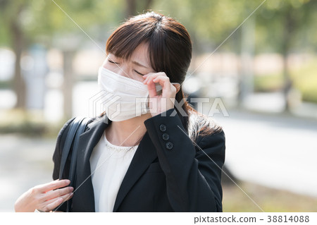 Businesswoman with mask Young woman 38814088