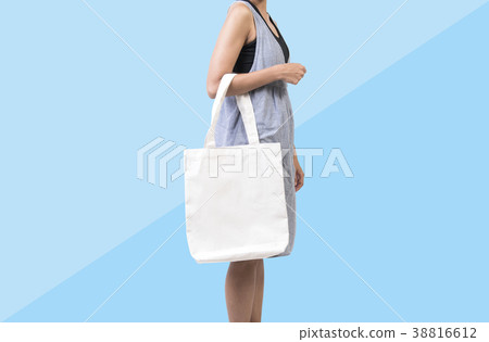 Girl holding bag canvas fabric for mockup template 38816612