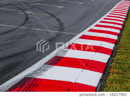 Asphalt of a race track detail with tire marks 38817963