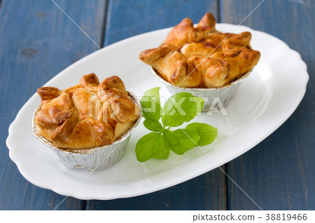 pie with chicken with basil on white plate  38819466