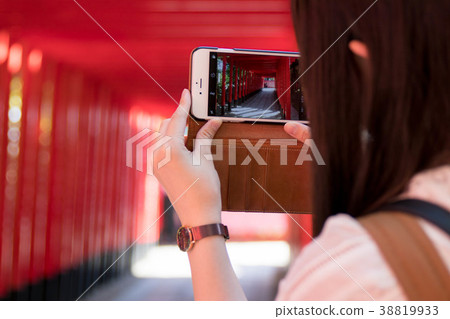 Shrine torii sightseeing over smartphone Sanko Inari 38819933