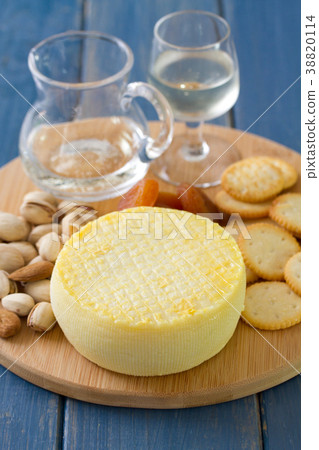 cheese with cookies, nuts and wine on tray cheese with cookies, nuts and wine on tray 38820114