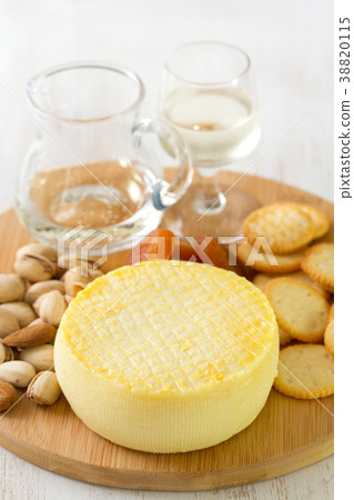 cheese with cookies, nuts and wine on tray cheese with cookies, nuts and wine on tray 38820115