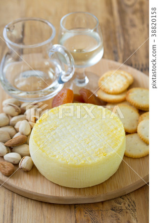 cheese with cookies, nuts and wine on tray cheese with cookies, nuts and wine on tray 38820158