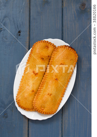 typical portuguese pie on plate on blue background typical portuguese pie on plate on blue background 38820166