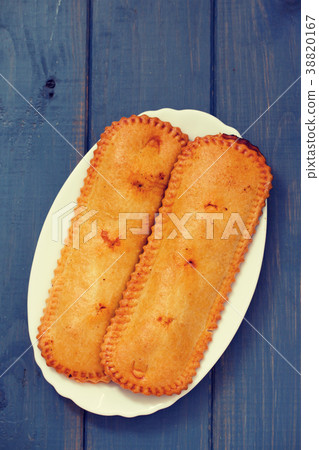 typical portuguese pie on plate on blue background 38820167