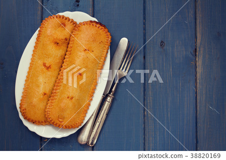 typical portuguese pie on plate on blue background 38820169