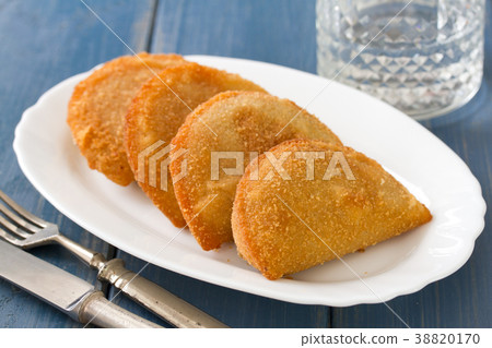 portuguese meat cookies, rissois on white dish 38820170